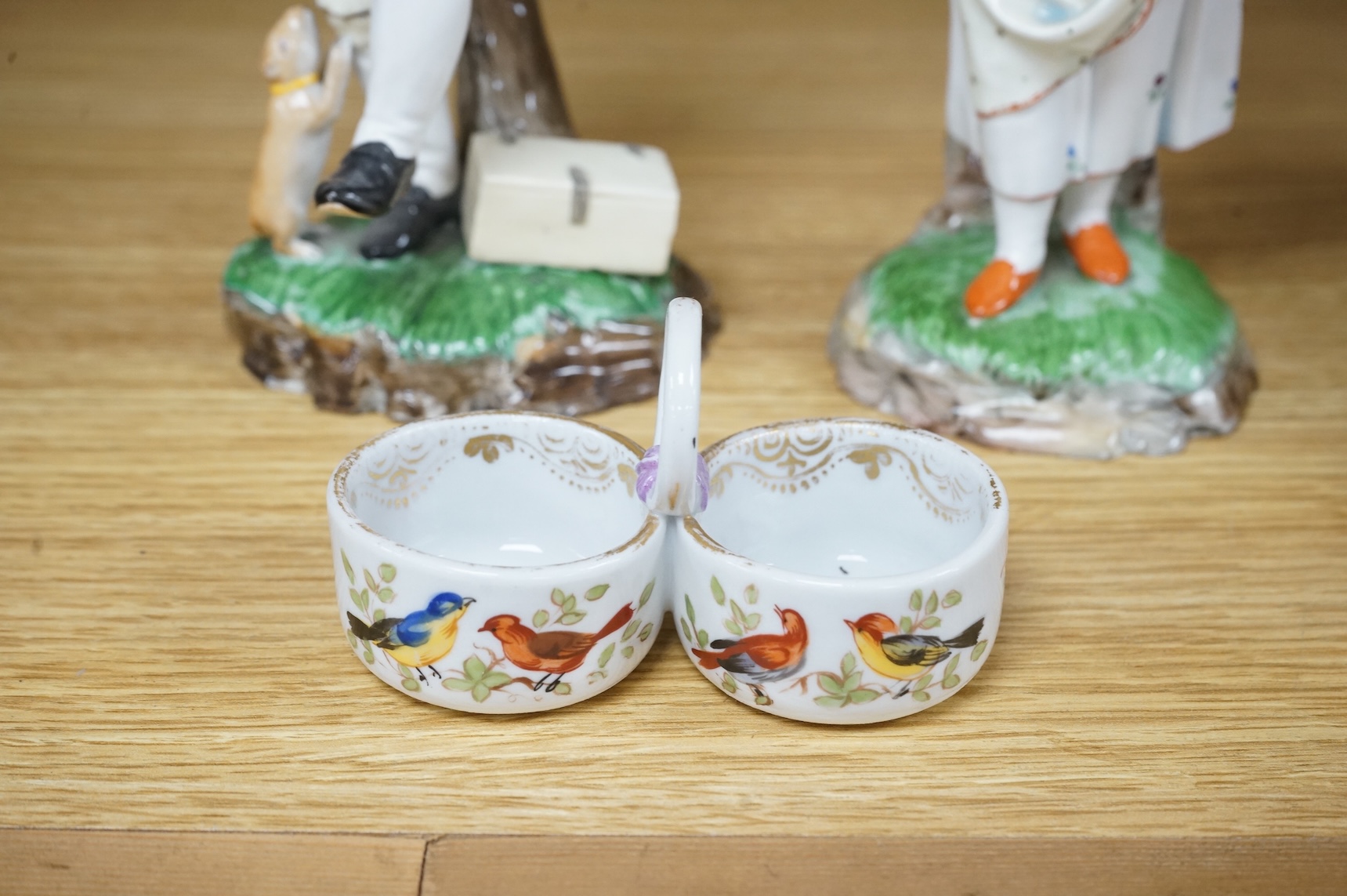 A pair of 19th century Hochst Damm faience figures and a Meissen twin section salt, tallest figure 20cm